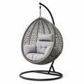 Sedia sospesa in rattan sintetico con base in acciaio e cuscini grigi in poliestere